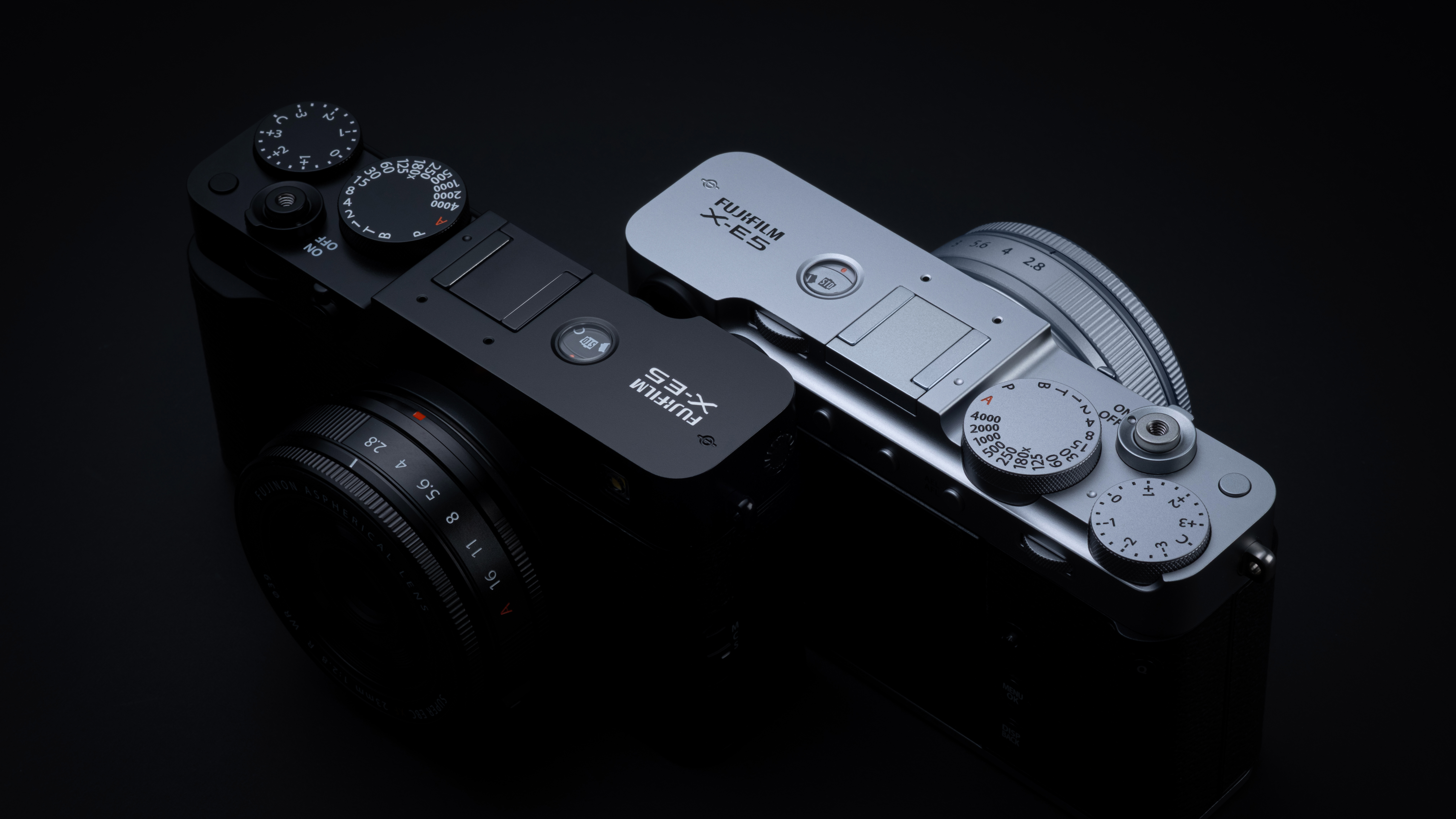 Fujifilm X-E5 cameras next to each other in black and silver in shadow