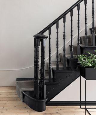 black staircase with white walls