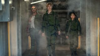 Trapper (Dan Stevens) Ilene Andrews (Rebecca Hall) and Jia (Kaylee Hottle) emerge from the Monarch outpost in Godzilla x Kong: The New Empire
