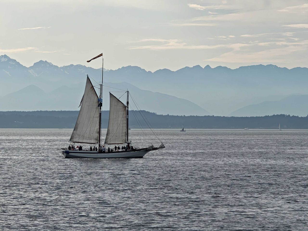 People on a sailboat in the distance