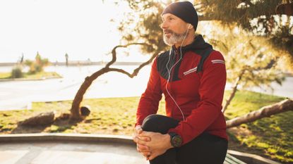 man resting after running in cold weather