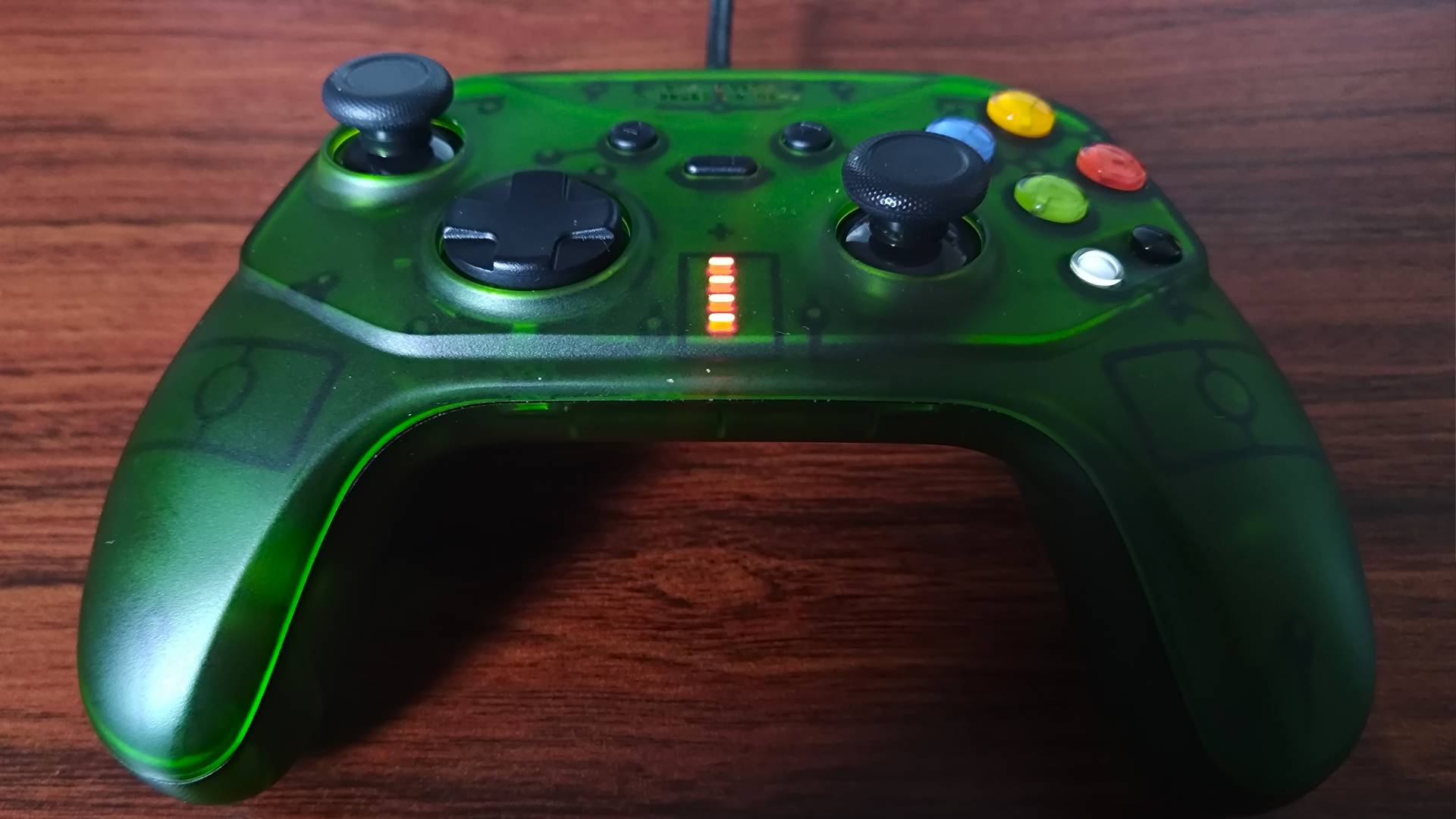Close up of Retro Fighters Hunter for OG Xbox with charging lights on.