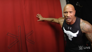 the rock at the curtain in gorilla during a wwe performance