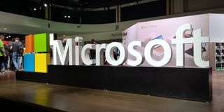 Large Microsoft sign on a show floor at Ignite 2019