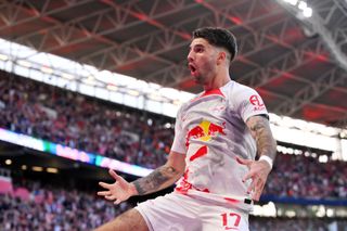 Dominik Szoboszlai of RB Leipzig celebrates after scoring the team's second goal during the Bundesliga match between RB Leipzig and SV Werder Bremen at Red Bull Arena on May 14, 2023 in Leipzig, Germany.