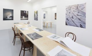 The exhibition presents books of original A2 panels and models submitted