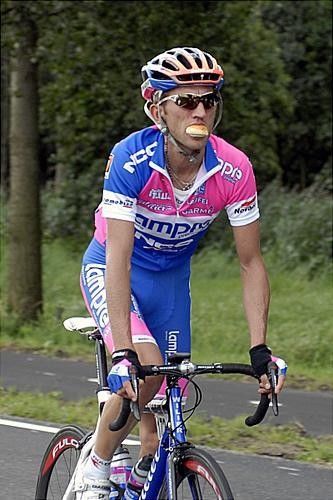 Polands Sylvester Szmyd (Lampre) grabs a mouth full of food during the stage.