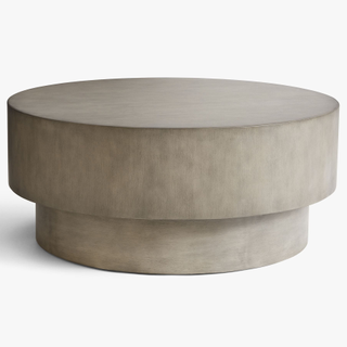 concrete-looking round monolith coffee table
