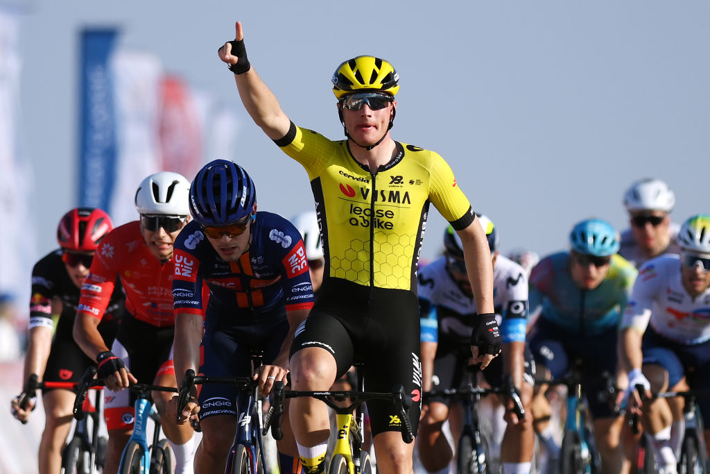 BIMMAH SINK HOLE, OMAN - FEBRUARY 08: Olav Kooij of Netherlands and Team Visma | Lease a Bike celebrates at finish line as stage winner ahead of Pavel Bittner of Czech Republic and Team Picnic PostNL and Erlend Blikra of Norway and Team Uno-X Mobility during the 14th Tour of Oman, Stage 1 a 177.7km stage from Bushar to Bimmah Sink Hole on February 08, 2025 in Bimmah Sink Hole, Oman. (Photo by Alex Broadway/Getty Images)