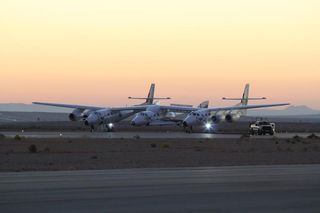 Virgin Galactic's first SpaceShipTwo passenger spaceliner and its WhiteKnightTwo carrier craft prepare to take off on the fourth rocket-powered flight test of the spacecraft on Oct. 31, 2014 at the Mojave Air and Space Port in California. 
