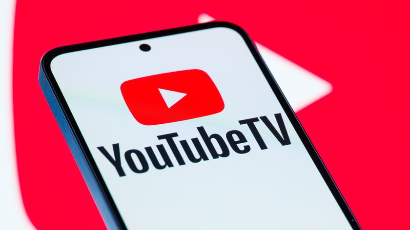 The YouTube TV logo is displayed on a mobile phone with the company branding play icon seen in the background, in this photo illustration in Brussels, Belgium, on November 11, 2025. (Photo by Jonathan Raa/NurPhoto via Getty Images)