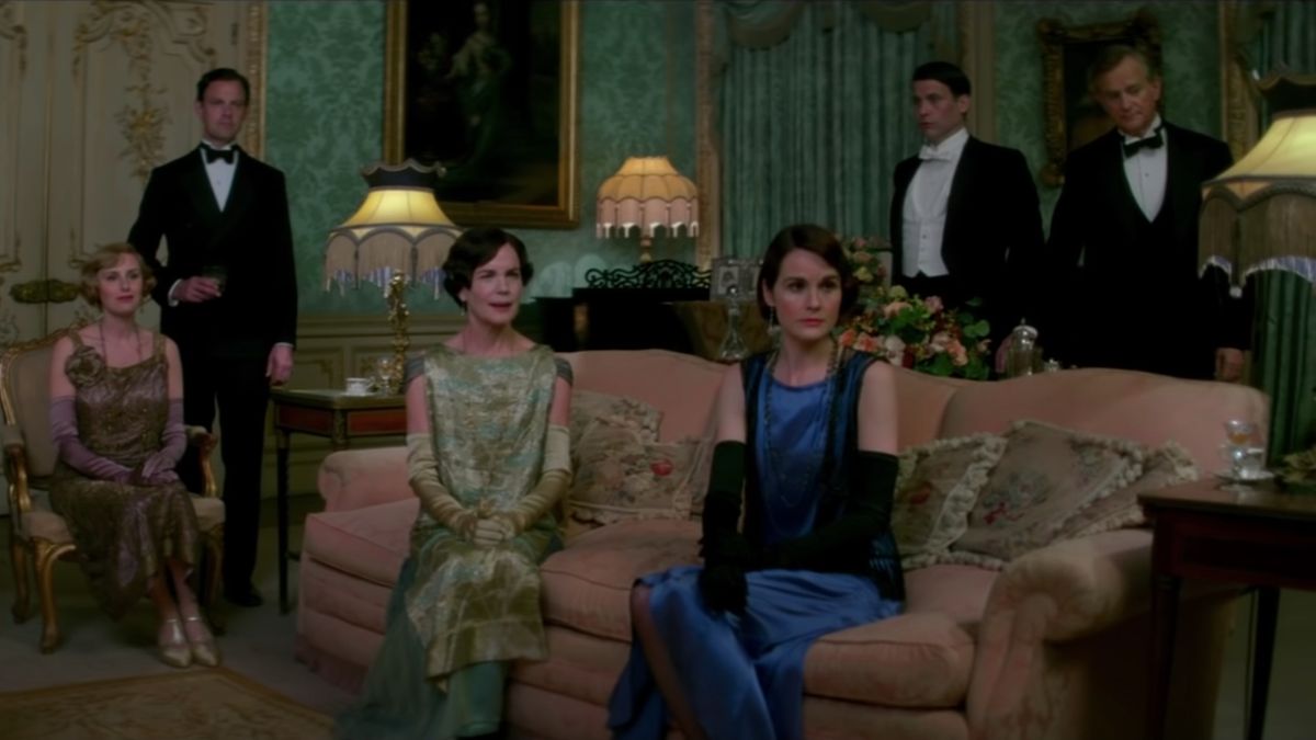 Lady Mary and the family gathered in a sitting room in Downton Abbey: A New Era.