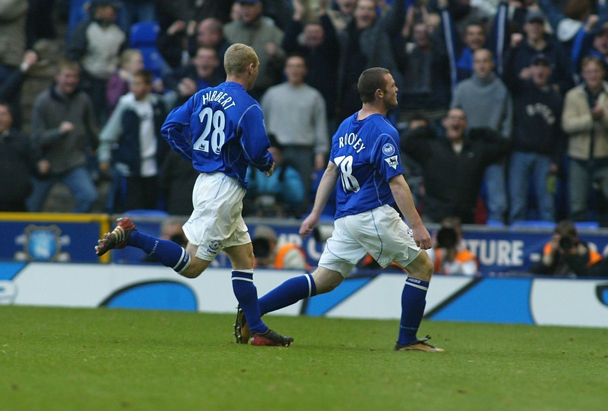Wayne Rooney of Everton celebrates with teammate Tony Hibbert after scoring his side's winning goal against Arsenal in the Premier League match at Goodison Park, October 2002