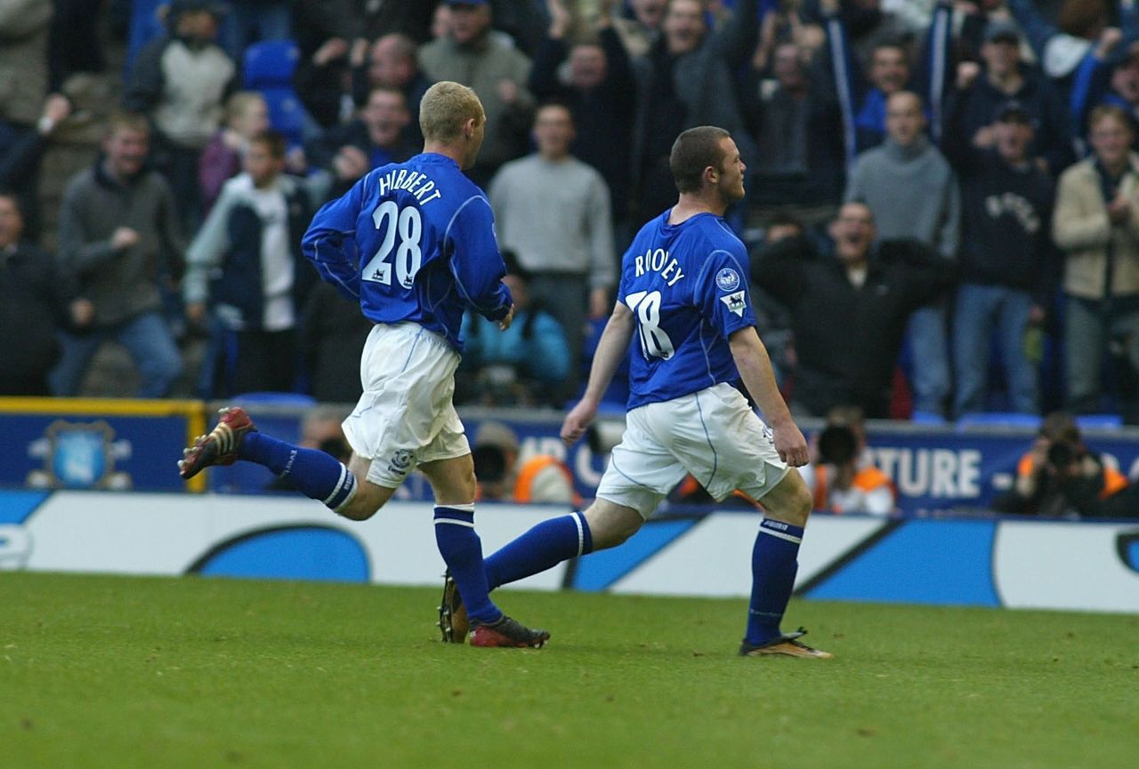 Wayne Rooney of Everton celebrates with teammate Tony Hibbert after scoring his side's winning goal against Arsenal in the Premier League match at Goodison Park, October 2002