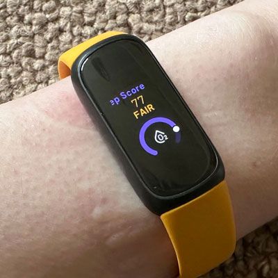 A Fitbit Inspire 3 on a person's wrist
