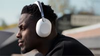 The rugby player and England captain Maro Itoje wearing some white headphones. 