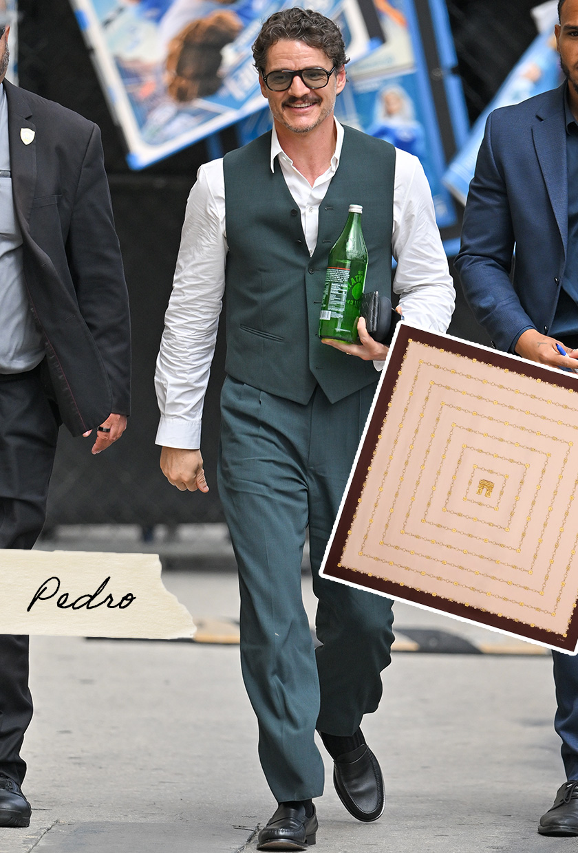 Pedro Pascal wearing a white button-down, a green waistcoat, and green trousers.