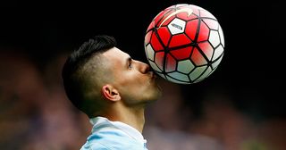 Sergio Aguero of Manchester City kisses the ball to celebrate a goal and his hat-trick during the Barclays Premier League match between Manchester City and Newcastle United at Etihad Stadium on October 3, 2015 in Manchester, United Kingdom.