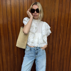 An image of @stephaniebroek wearing a peasant top, one of the biggest spring blouse trends.