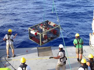 Researchers recover the trap after it landed on the bottom of the Mariana Trench.