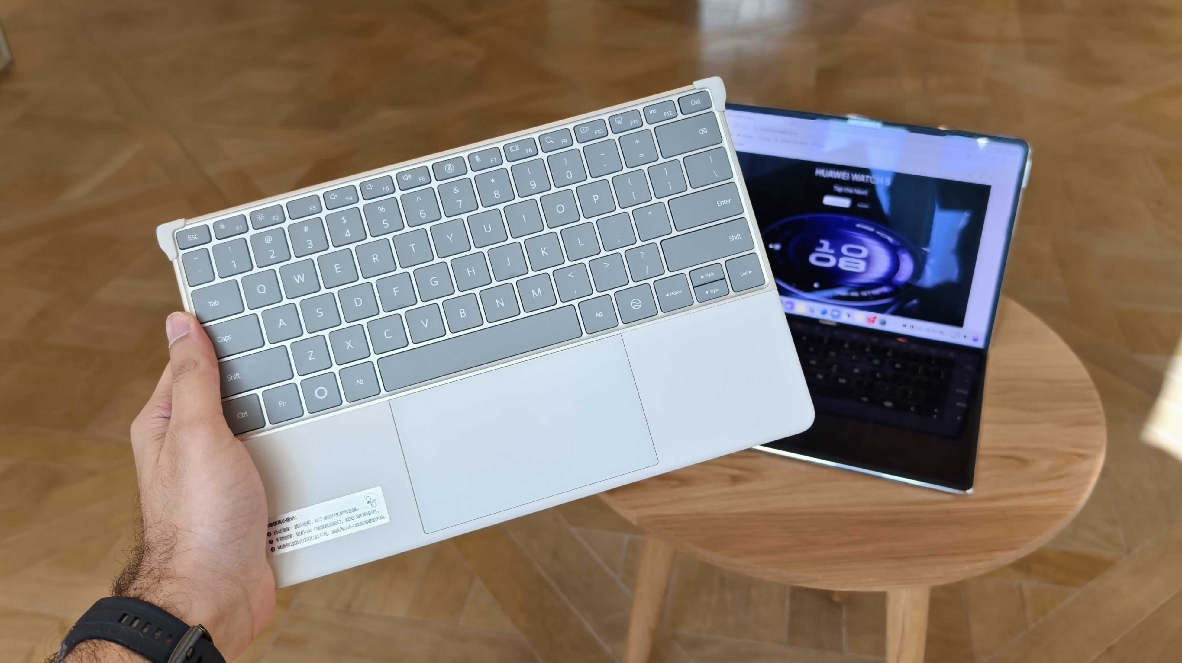Prakhar Khanna holding Huawei MateBook Fold&#039;s keyboard.