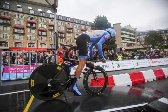 David Millar , Garmin Sharp heads of in the damp weather.