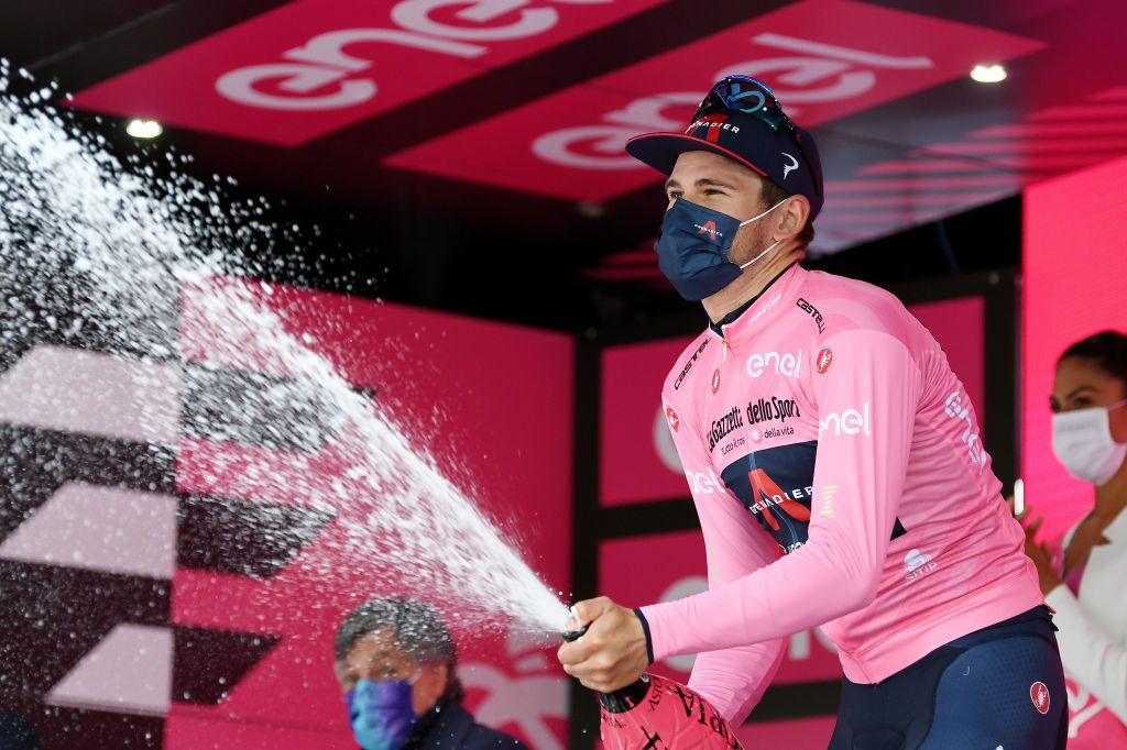 CANALE ITALY MAY 10 Filippo Ganna of Italy and Team INEOS Grenadiers Pink Leader Jersey celebrates at podium during the 104th Giro dItalia 2021 Stage 3 a 190km stage from Biella to Canale girodiitalia Mask Covid safety measures Champagne Giro on May 10 2021 in Canale Italy Photo by Tim de WaeleGetty Images