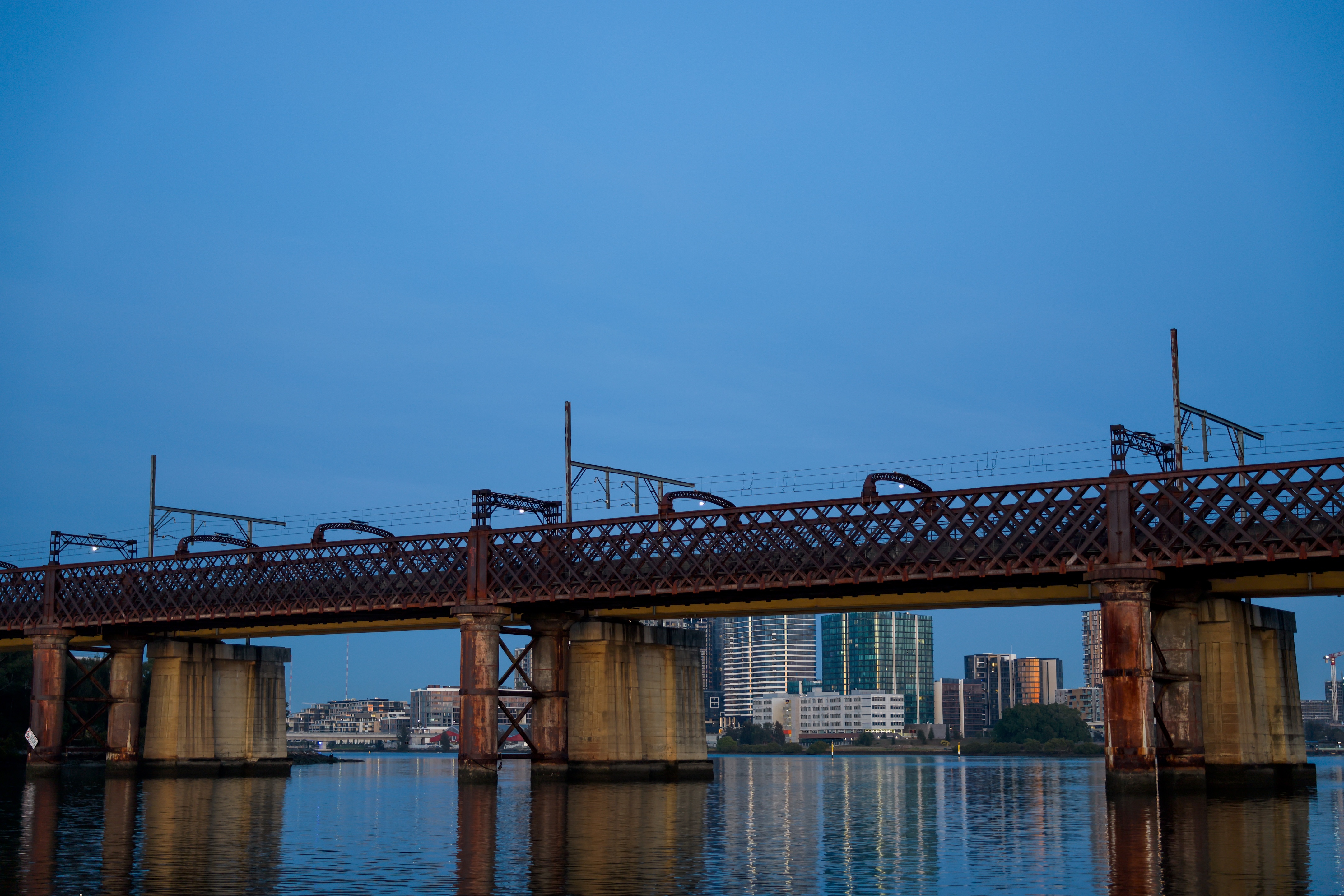 A bridge across a river at dawn