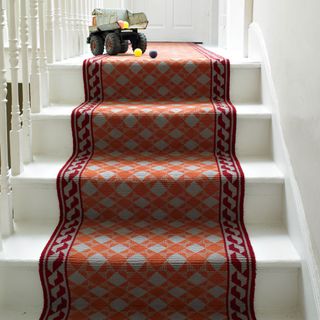trendy carpet on white flooring staircase