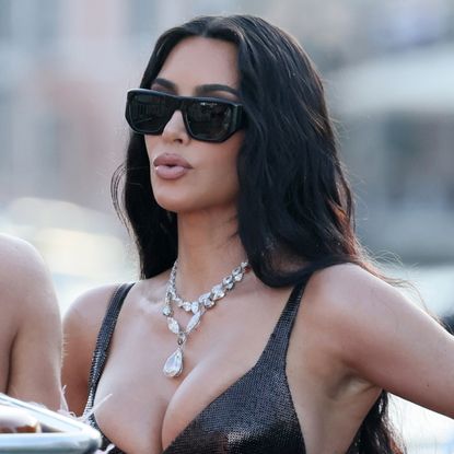 Kim Kardashian wearing a vintage Versace gown made from chainmail and lace in Venice