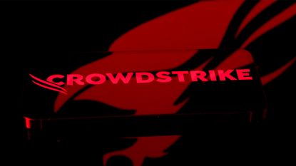 Close-up shot of the CrowdStrike logo and branding pictured on a smartphone screen, with company icon in background.