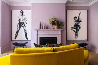 a purple living room with a yellow sofa