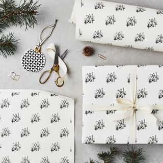 Christmas wrapping, black and white with scissors, cream ribbon