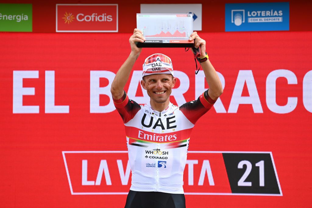 EL BARRACO SPAIN AUGUST 29 Rafal Majka of Poland and UAE Team Emirates celebrates winning the stage on the podium ceremony after the 76th Tour of Spain 2021 Stage 15 a 1975km km stage from Navalmoral de la Mata to El Barraco lavuelta LaVuelta21 on August 29 2021 in El Barraco Spain Photo by Stuart FranklinGetty Images