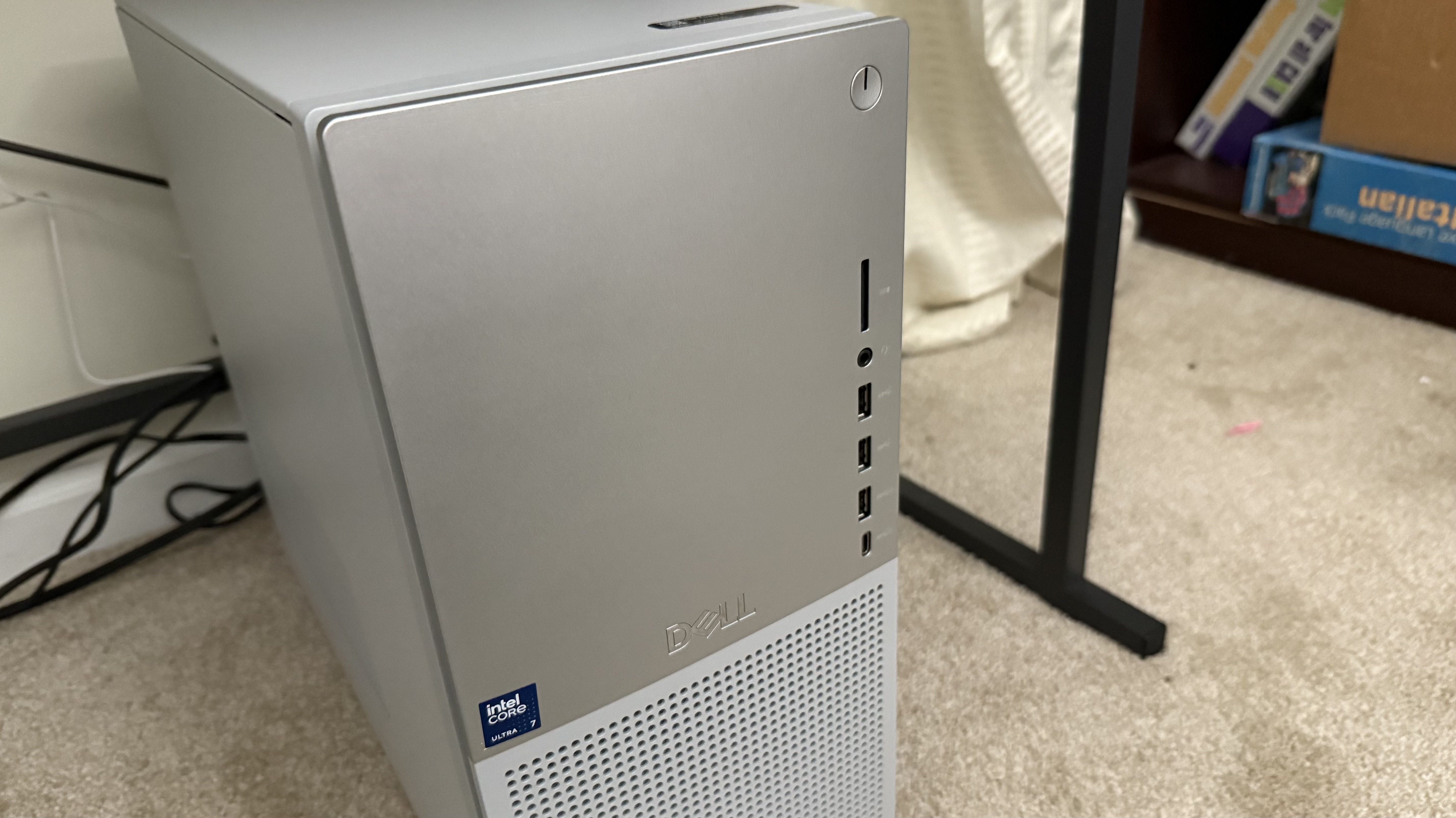 Dell Tower Plus desktop resting on carpet