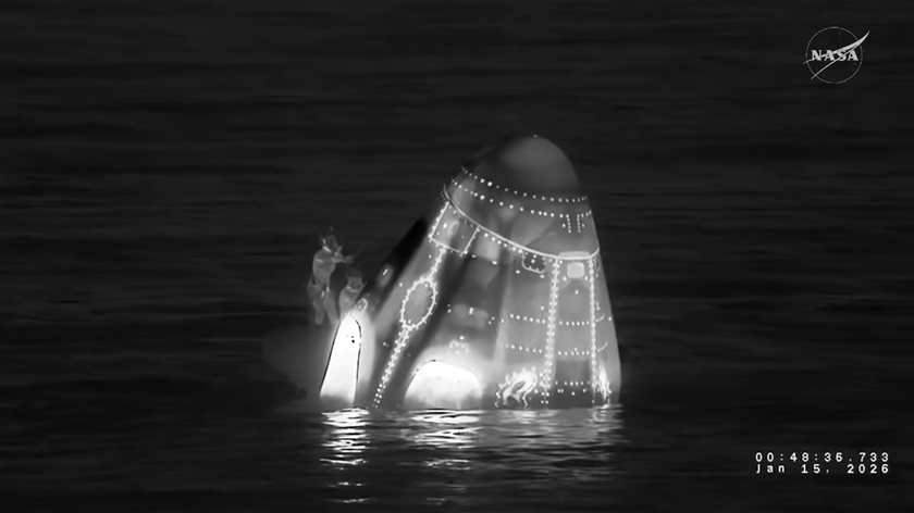 A night vision image of the SpaceX Dragon capsule floating in the Pacific Ocean. 