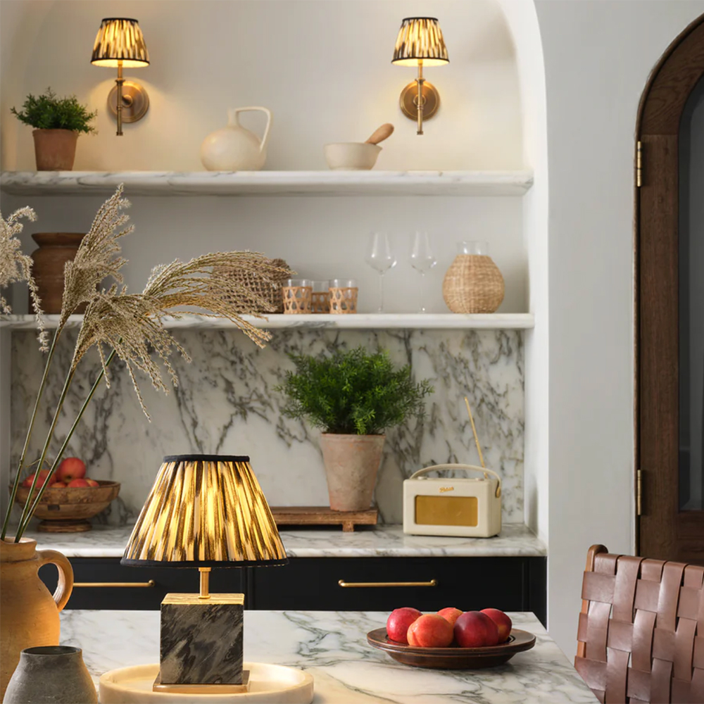 Quiet luxury kitchen with wall lights and table lamp