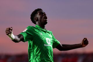 Assane Diao Diaoune of Real Betis celebrates after scoring the team's first goal during the LaLiga EA Sports match between Granada CF and Real Betis at Estadio Nuevo Los Carmenes on September 28, 2023 in Granada, Spain.