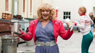 Beverly dancing on the street in The Goldbergs