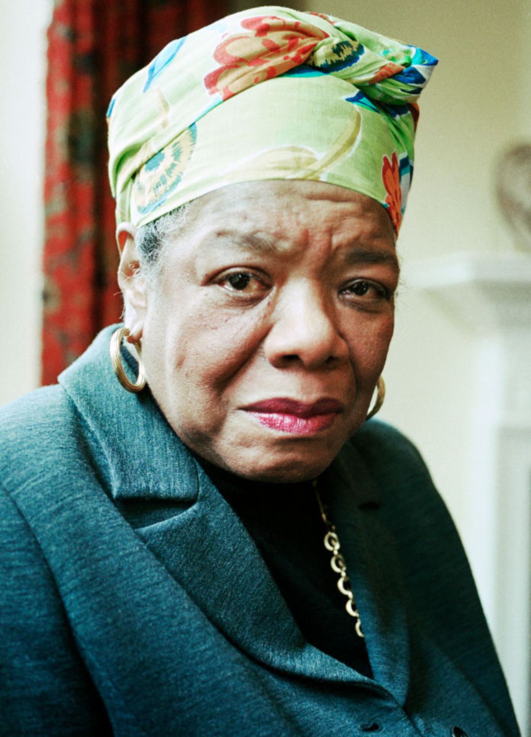 Maya Angelou wearing a green floral print headscarf