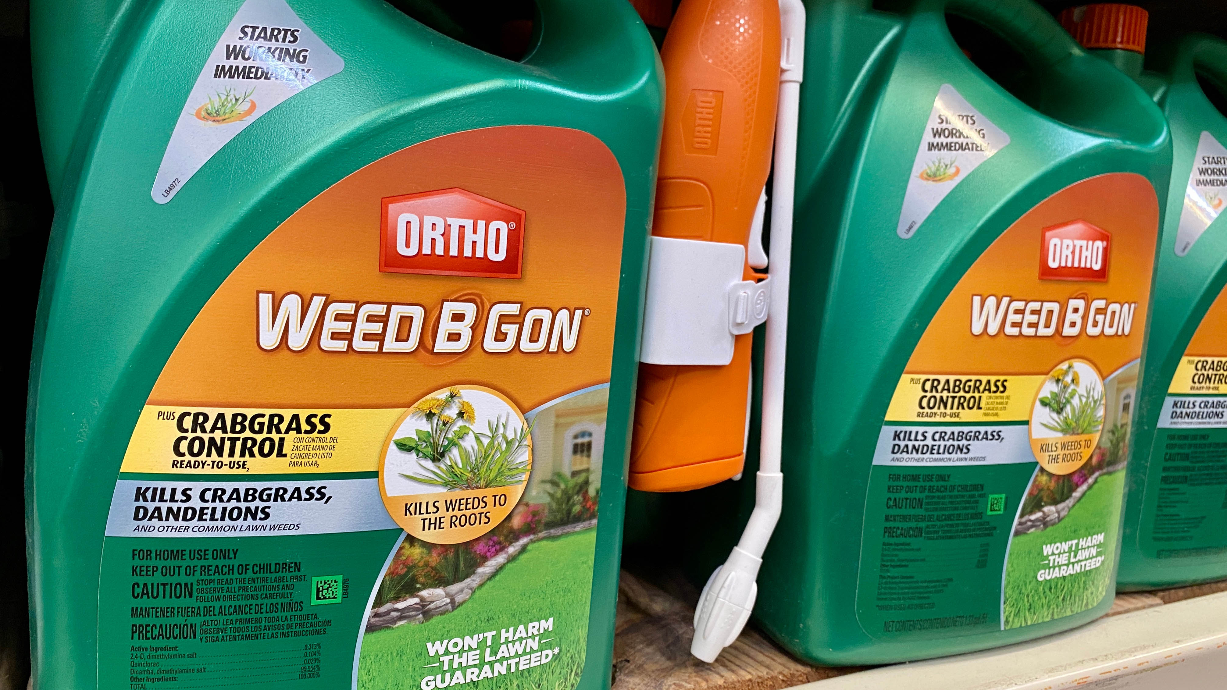 Two bottles of postemergence herbicide designed to kill crabgrass without harming the lawn