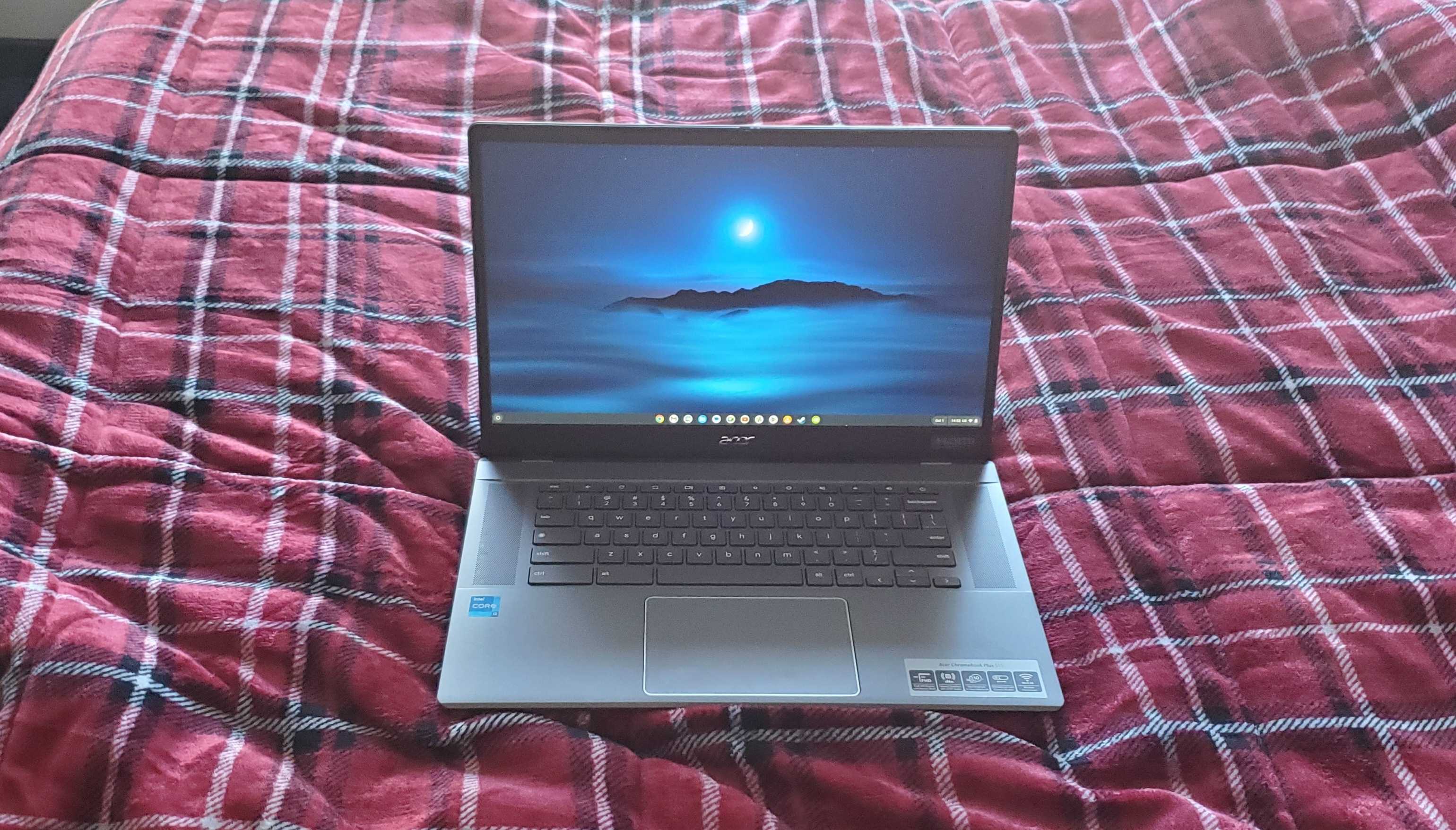 chromebook plus laptop sitting on bed