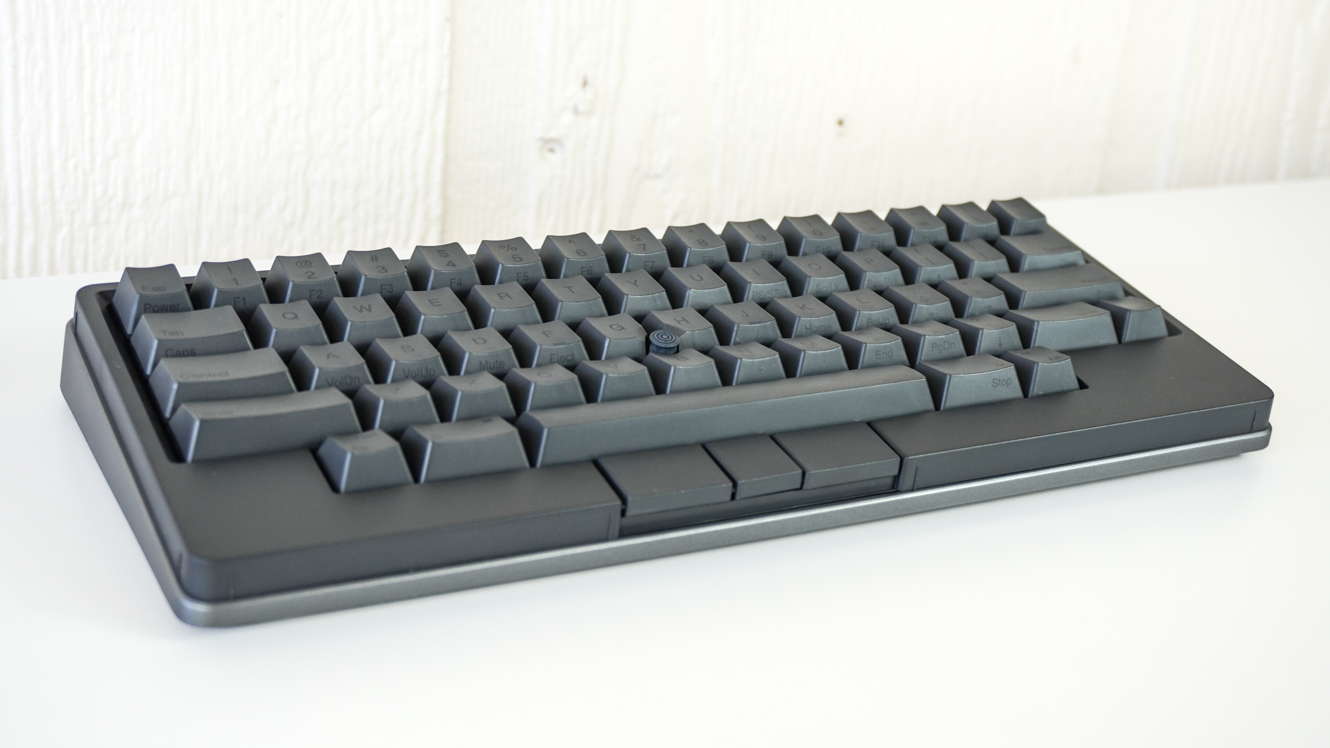 The HHKB Studio keyboard on a white desk