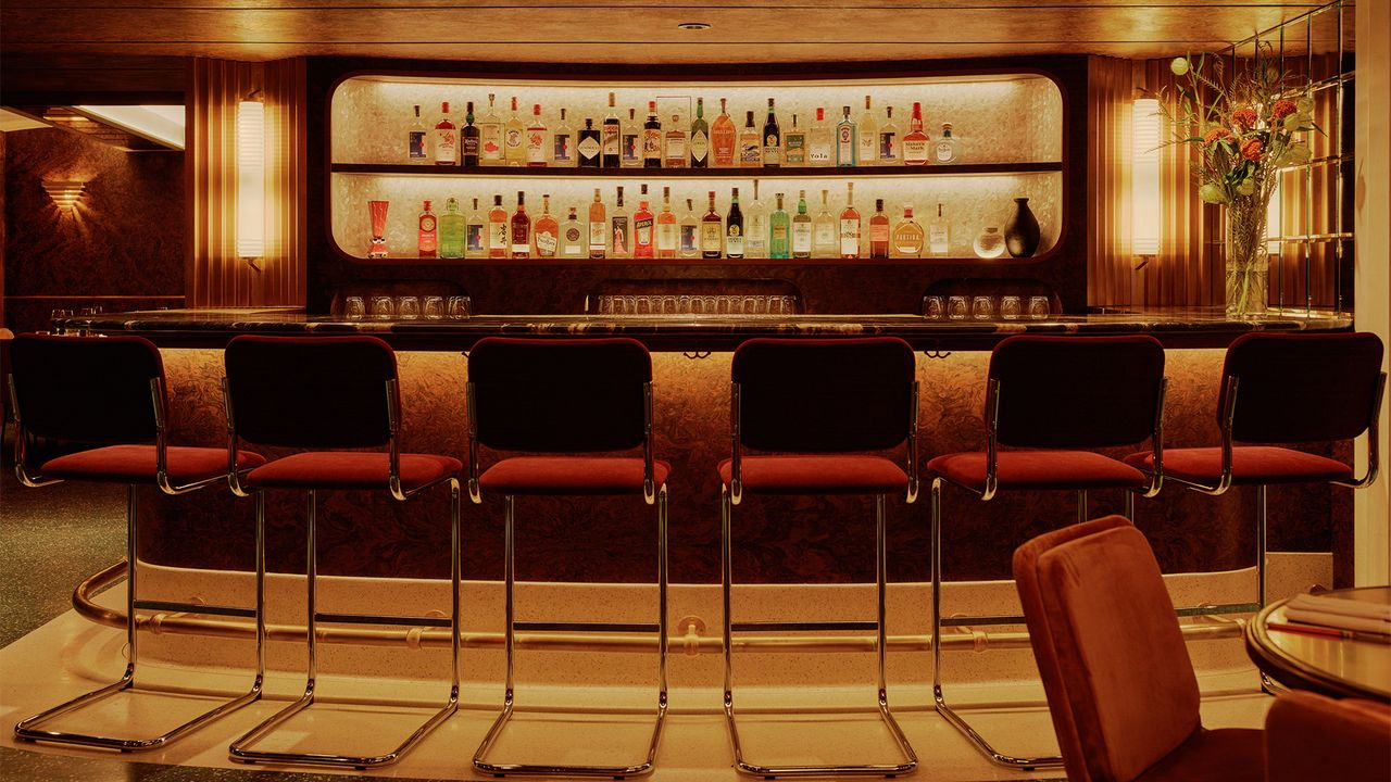 A Negroni bar with orange lighting