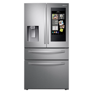 Silver french door style refrigerator from Samsung with multiple freezer compartments and a water dispenser.