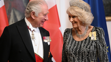 King Charles speaks with Camilla at a state dinner