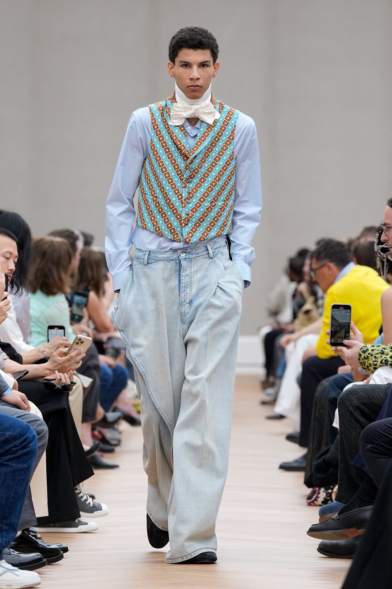 A model wore a two-tone diagonal dotted vest on the Dior Spring 2026 runway