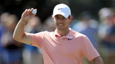 Rory McIlroy throws golf ball