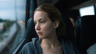 Jennifer Lawrence as Lynsey, riding a bus, in Causeway.