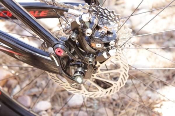 X0 brake caliper, with a 1070 cassette in the background.